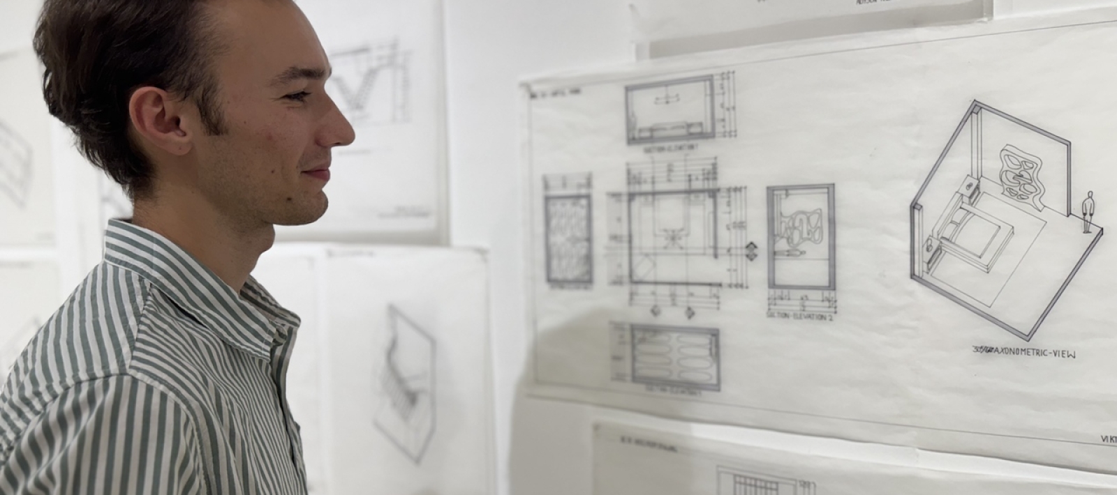 Student viewing interior design renderings